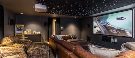 Movie Theatre with a couch that comfortably sleeps 4 adults!
