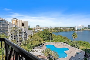 Balcony overlooking the pool and lake with great views of Universal from afar