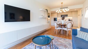 Big flat screen TV, where you can assist to your favourite tv shows, while enjoy the comfort of our couch. #comfort #lvingroom