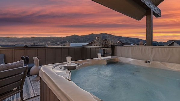Soak in the private hot tub on the rooftop level