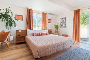 #1 Bright, spacious bedroom with Cal King memory foam mattress on a platform bed.