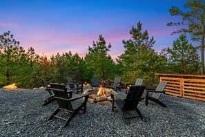 Outdoor Fire Pit: Gather around the fire pit for stories and s'mores beneath breathtaking sunsets!