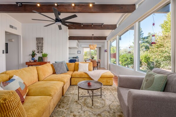 spacious living room with huge windows facing Red Rocks