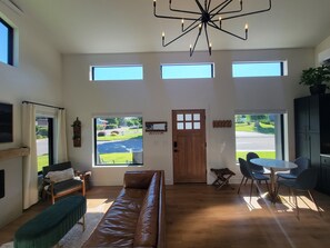 Looking towards the front entry door showing living room and kitchen. 