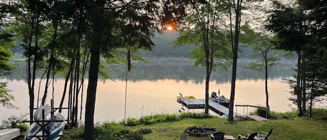 Sunrise from the deck overlooking the backyard and dock.