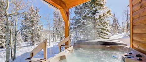 Warm up, cool down, and repeat in our cabin's bubbling hot tub.