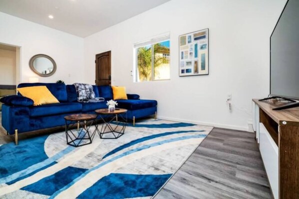 Spacious and cozy living room with AC/Heater and 4K Smart TV