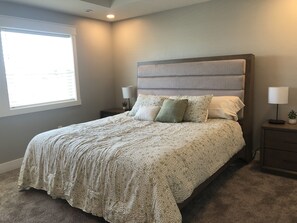 Primary Bedroom with King Size Bed, Smart t.v., attached bathroom and closet