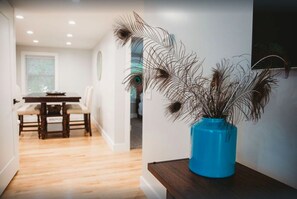 Standing in living room looking towards dining table.