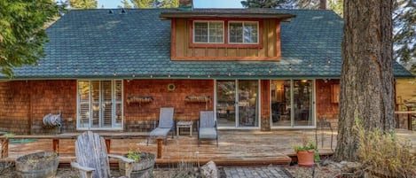 This 5-bedroom home is tucked among the trees in Carnelian Bay and features a fantastic fenced backyard with a hot tub.