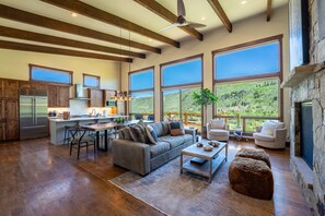 Open concept kitchen, dining and living areas