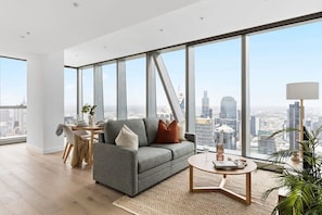 A spacious living area with a 3-seater sofa bed.