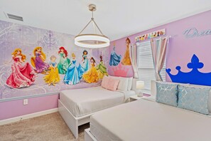 Experience enchantment in our princess-themed bedroom, where two cozy beds await little ones for a magical stay.