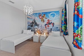 Marvel and DC Themed Bedroom of the Townhouse in Davenport Florida - Drift into a world of adventure in our Hero-themed bedroom - Twin Single beds set the stage for a supercharged stay