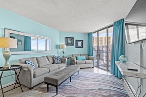 This comfy living room offers space for everyone to gather!