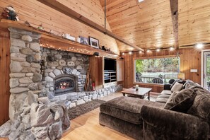 River rock gas hearth with a cozy nook