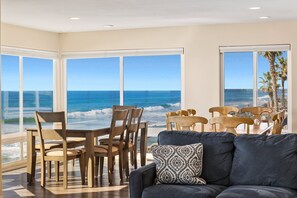 Two dining area tables with seating for 10