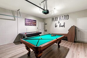 Game room with 8-foot pool table, air hockey, shuffleboard, skeeball & foosball