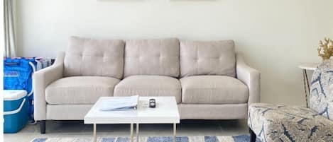 Fully equipped living room with AC and Smart TV.