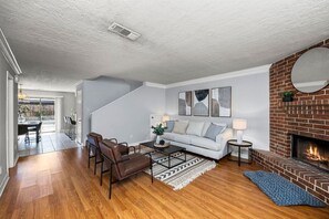Sit back and relax on the comfortable couches and chairs; enjoy the fireplace in the living room.