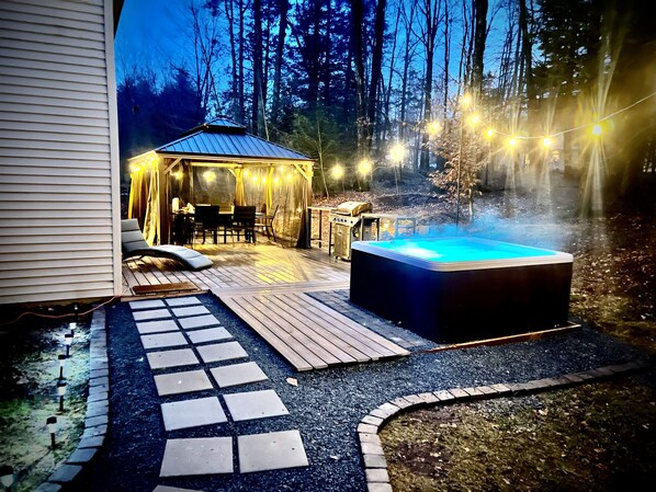 Enjoy the natural beauty with your private hot tub and secluded back deck