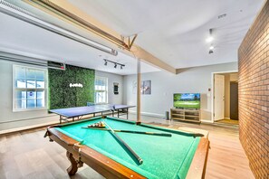 Game room with pool table, ping pong, and PS4.