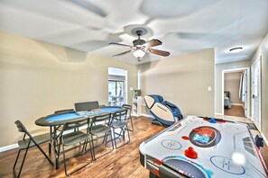 Second game room with poker table, massage chair, and more