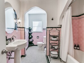 Living your Barbie Girl dreams in this art deco-style pink bathroom!