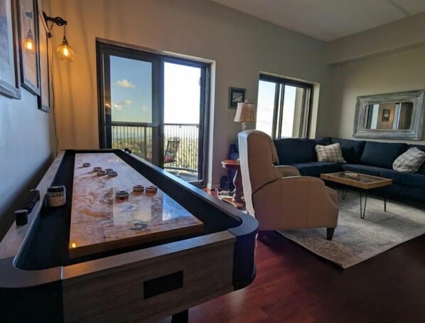 Enjoy the living room cuddled up in front of the cozy electric fireplace. 