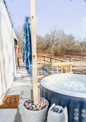 Dive into Relaxation: the hot tub fits 4 to 6 comfortably.