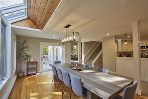 Cozy up by the warm, crackling fire in this modern Vermont escape. With soaring wood-beamed ceilings and an extra-large sectional, this spacious retreat is perfect for relaxing after a day of outdoor adventures.