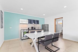 Our studio unit boasts a small kitchenette equipped with all the essentials, allowing you to prepare delicious meals and enjoy dining in the comfort of your own space.