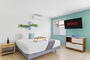 "Indulge in a restful retreat in our thoughtfully-appointed studio, complete with a plush king bed and entertainment options.