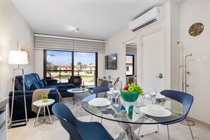 Bright and modern living space with cozy seating, a dining area, and beautiful views.