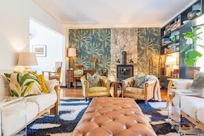 Warm, vibrant living room with wood stove