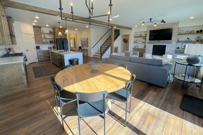 Gather around the dining table for food, conversation, and fun.