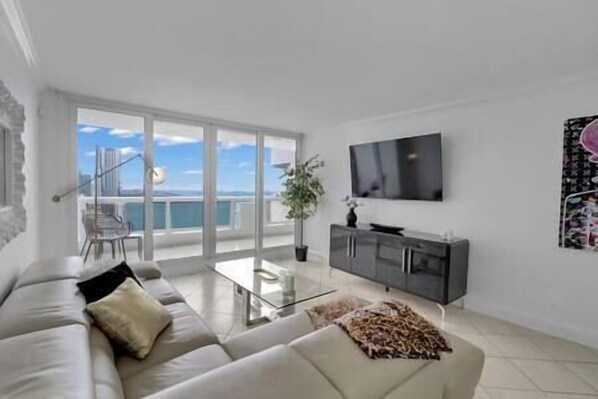 Living area, Roku streaming tv, balcony access, water views of Biscayne Bay!