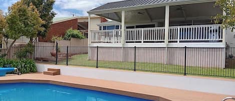 Salt-chlorinated in-deck pool complete with toys and lounges