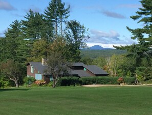 The Guest House sits on beautiful grounds.  Its view extends to NH mountains.