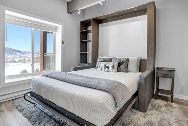 The living room transforms into a comfortable queen size bed!