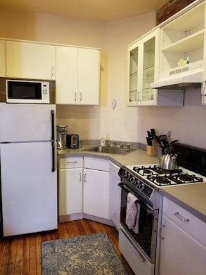 Galley kitchen with all the basic essentials, including a Keurig coffeemaker