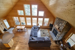 Spacious and cozy living room with fireplace.