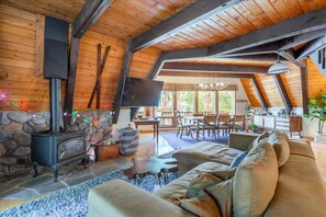Open concept living room / dining area / kitchen that opens up to back deck.