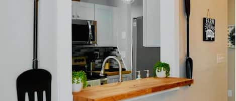 Breakfast counter and large dining table.