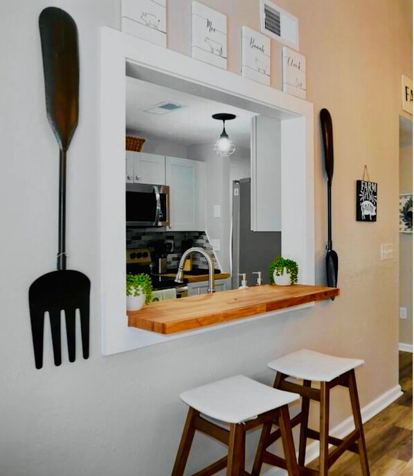 Breakfast counter and large dining table.