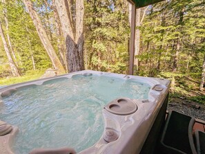 Warm up and ease your sore muscles in our hot tub surrounded by scenic evergreens