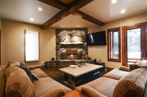 Great room w/ fireplace and TV