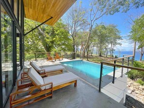 Infinity Pool with Ocean and Jungle Views