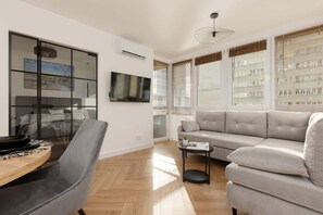 Another angle of the living area, highlighting the bright interior and elegant furnishings.
