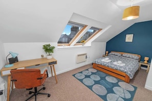 Master bedroom with a double bed, comfortable bedding, w/ fresh linens, and towels provided
